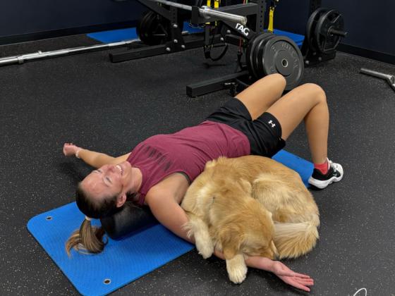 Me stretching with my Golden Retriever laying on my arm.