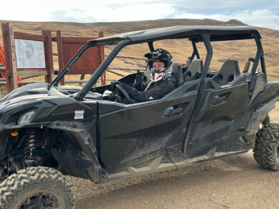 Me driving a UTV in the mountains.