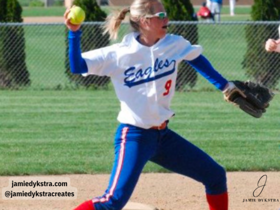 A picture of me playing softball in high school throwing the ball from the shortstop position.