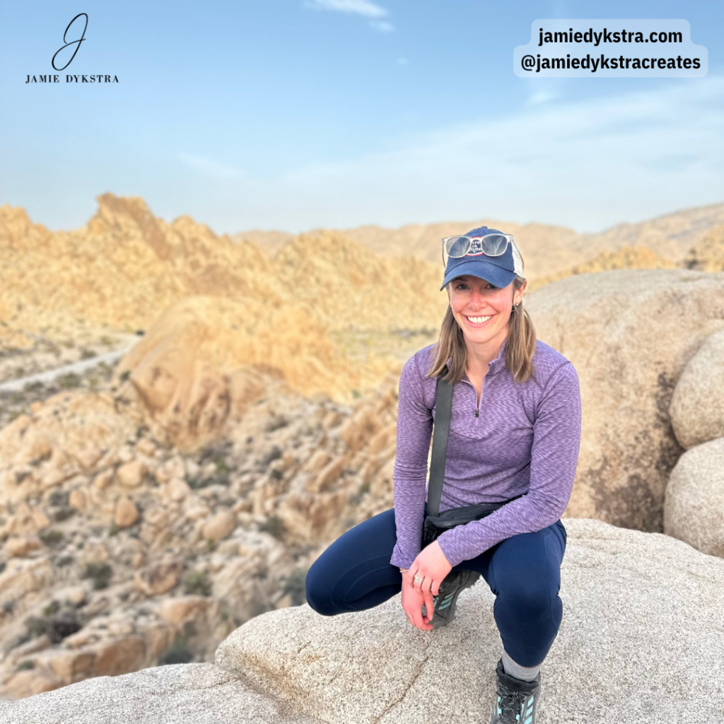 A picture of me squatting down on the top of a rock scramble in Joshua Tree National Park.