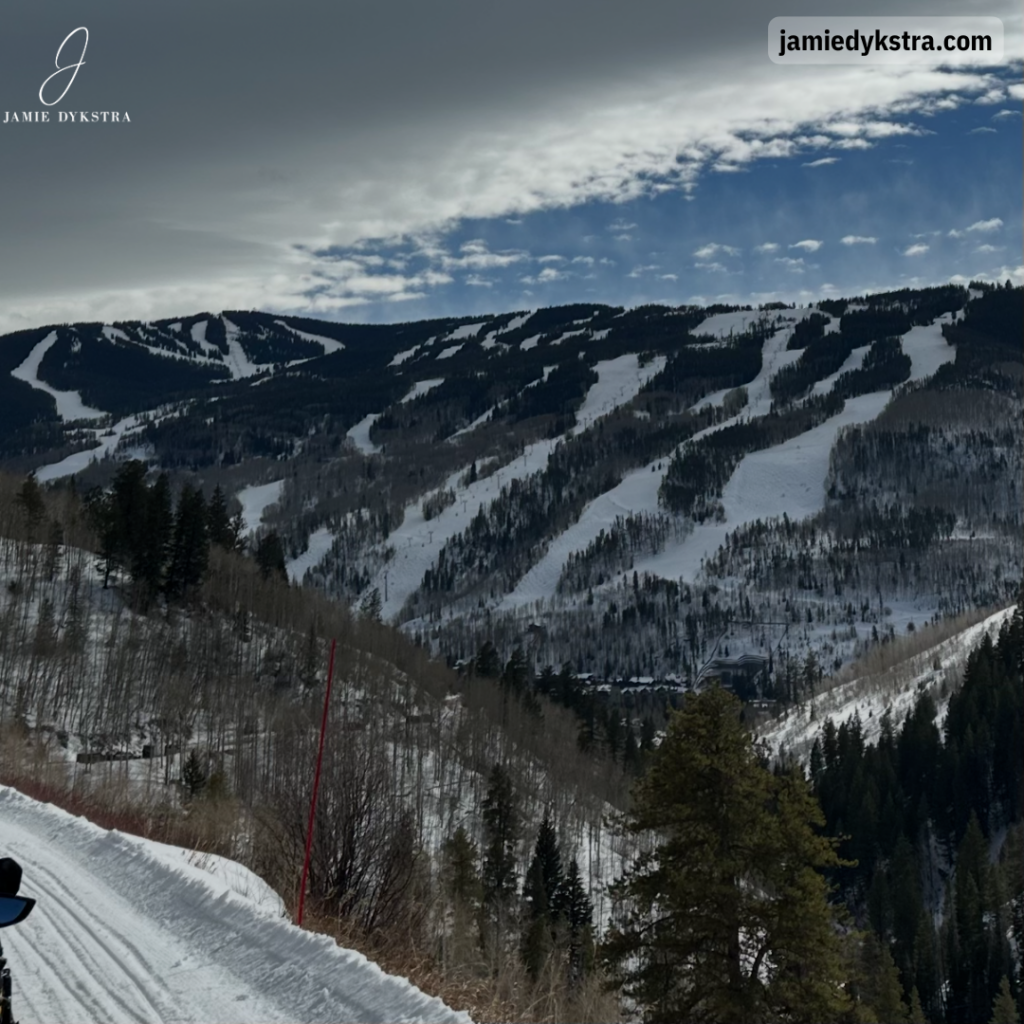 A photo from a mountain of ski runs on another mountain.