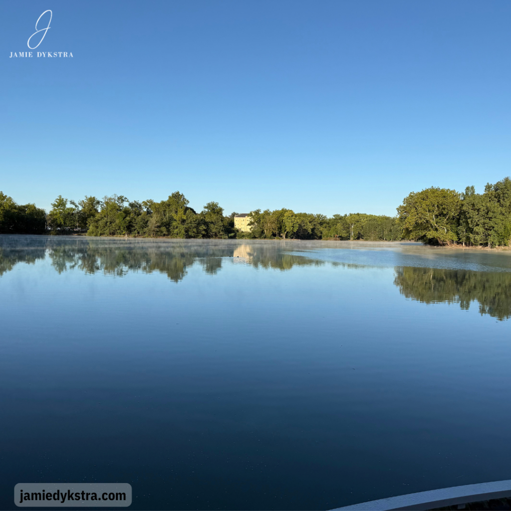 A picture of a small, calm lake.
